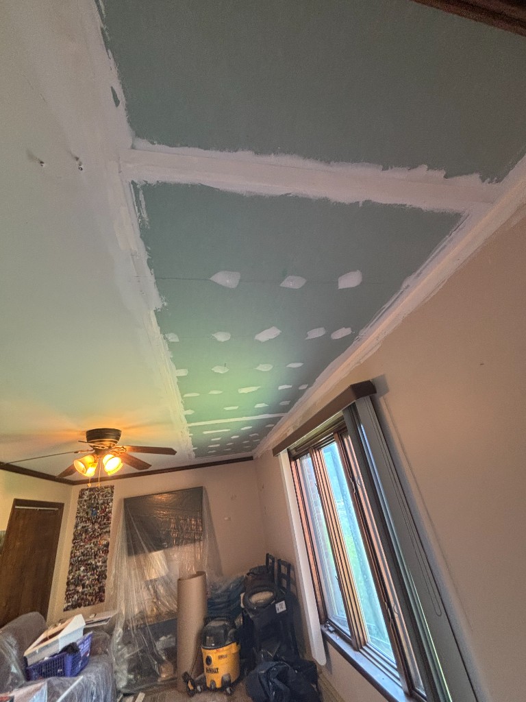 Ceiling drywall with joint compound, furniture protected