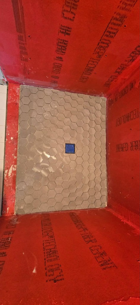 Shower waterproofing membrane with hex tile floor started