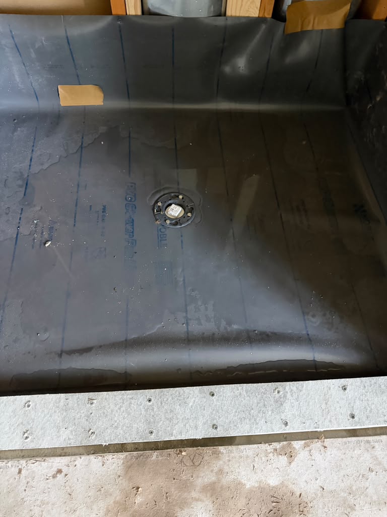 PVC shower pan liner flood test in progress